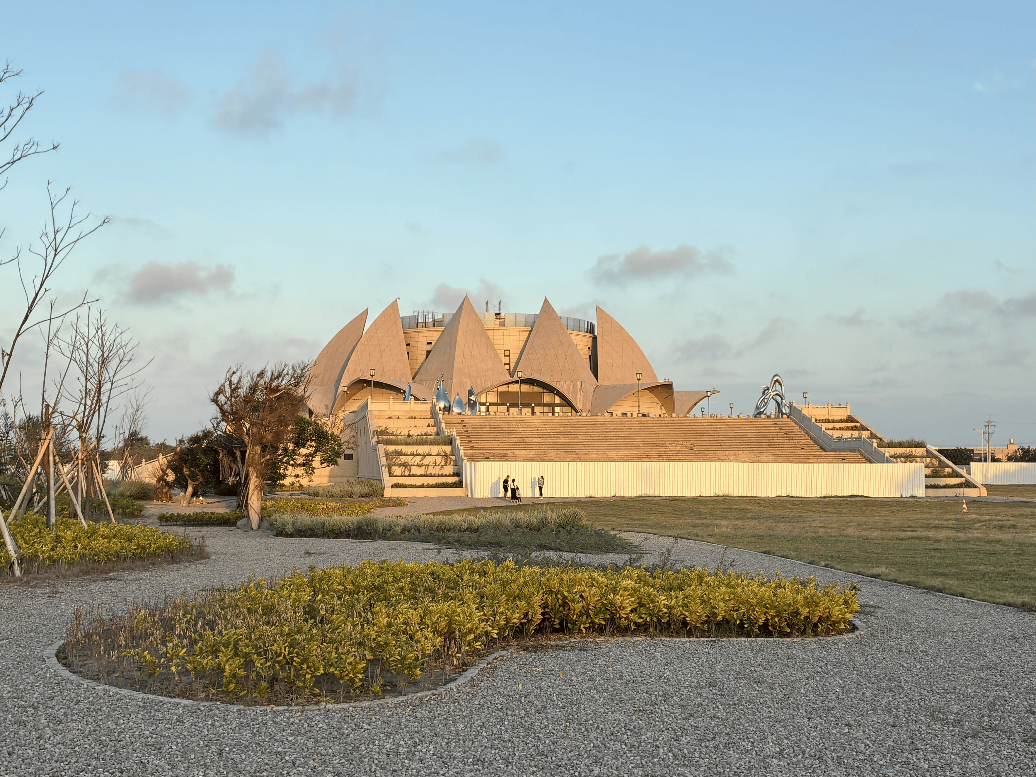 The sky is clear and the trees are leafless.