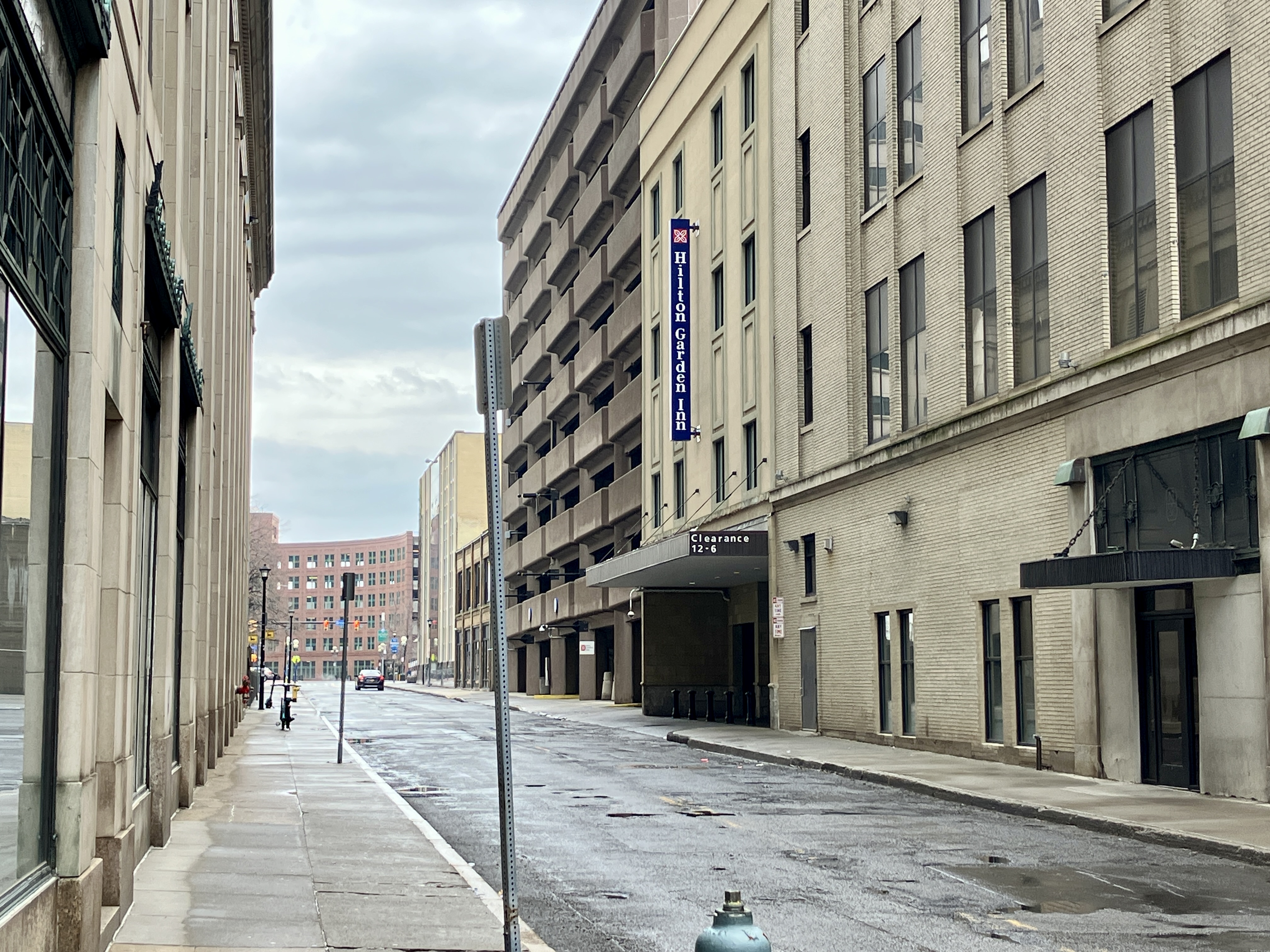 A Hilton Garden Inn and an empty alley road.