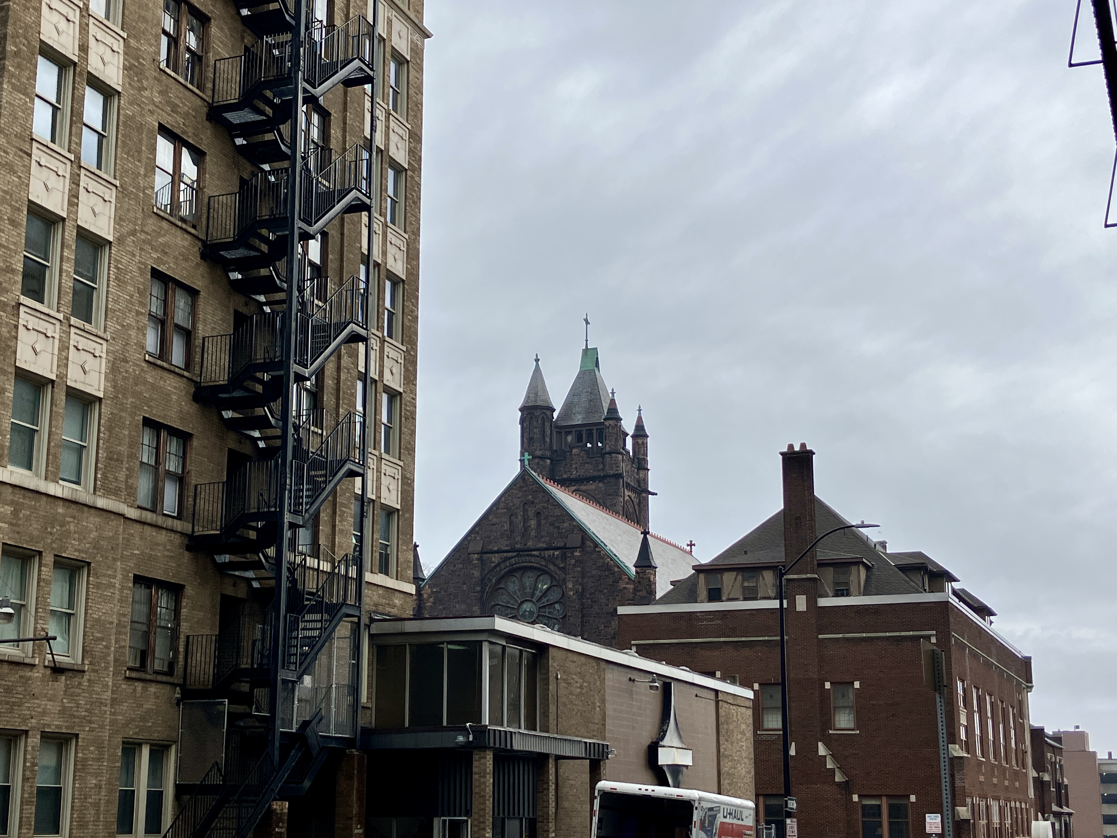Old buildings, a fire staircase, and an old church.