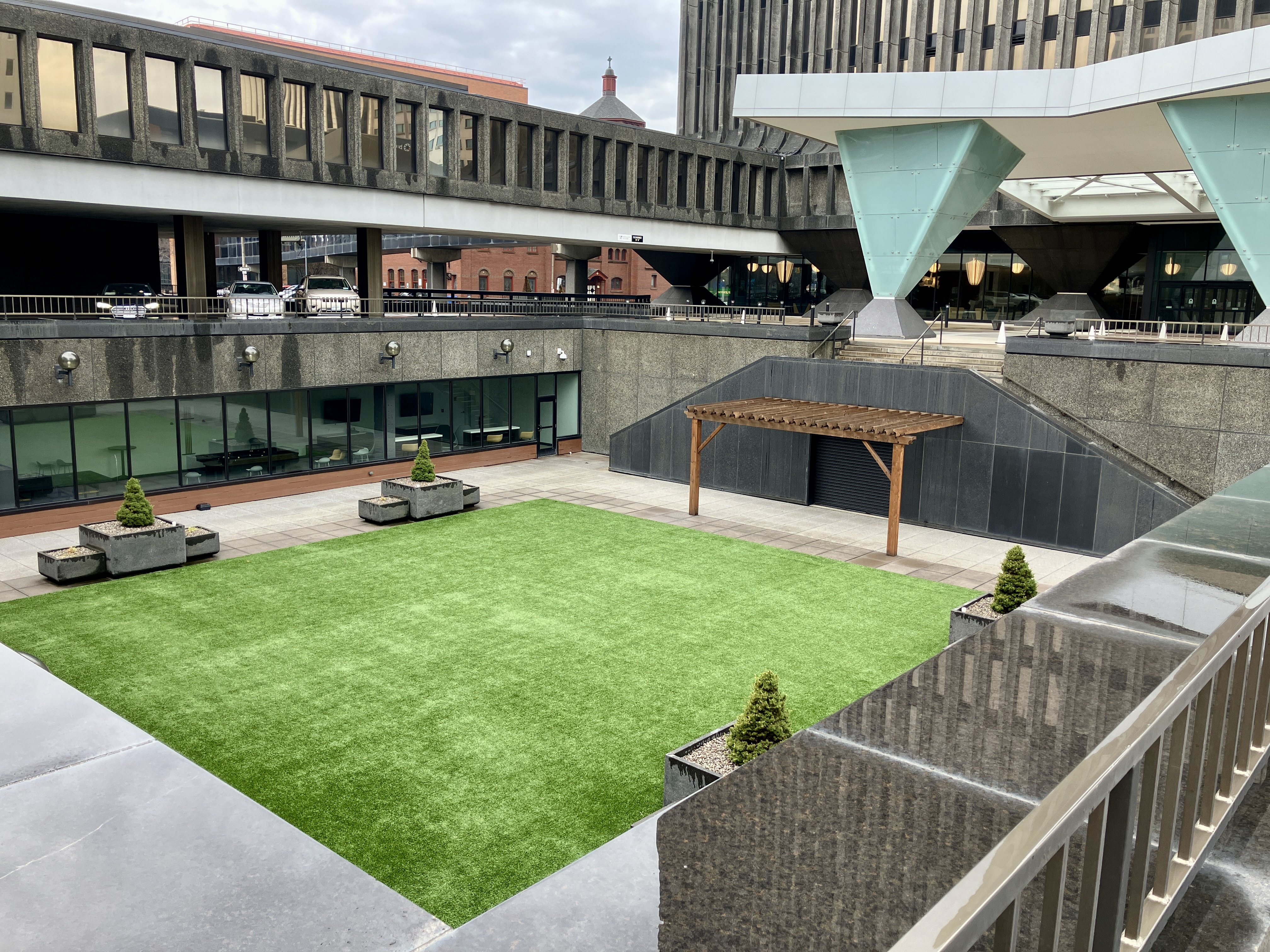 A grass square in the middle of downtown.